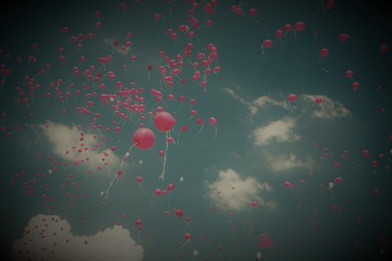 balloons floating into the sky